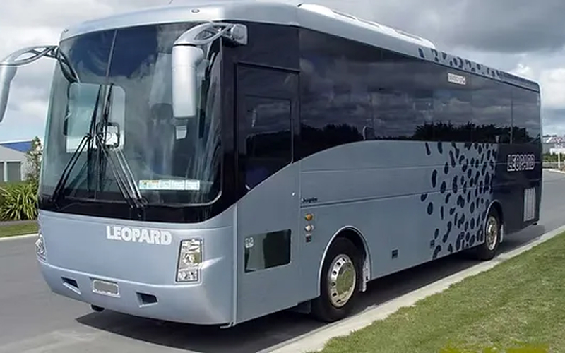 Corporate bus parked for business staff transport services.